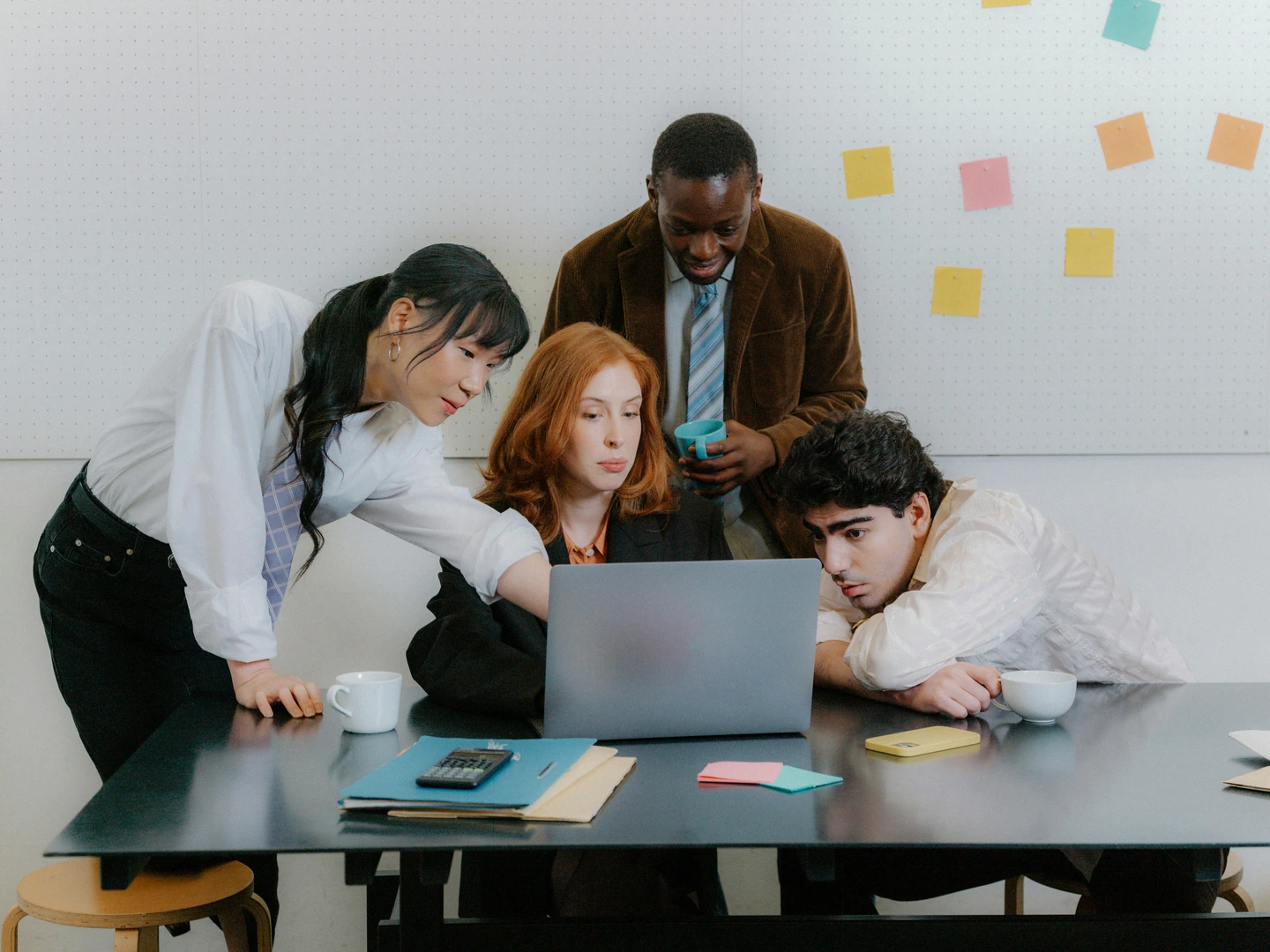 A creative team gathered around a project